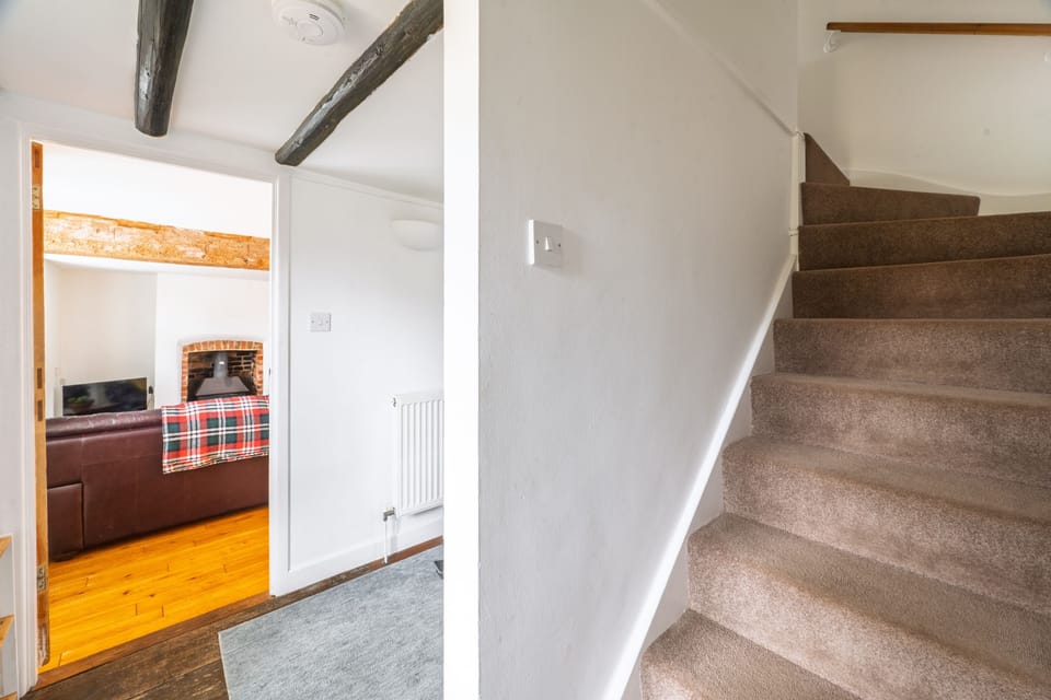 Ground floor: The hallway stairs lead to the first floor