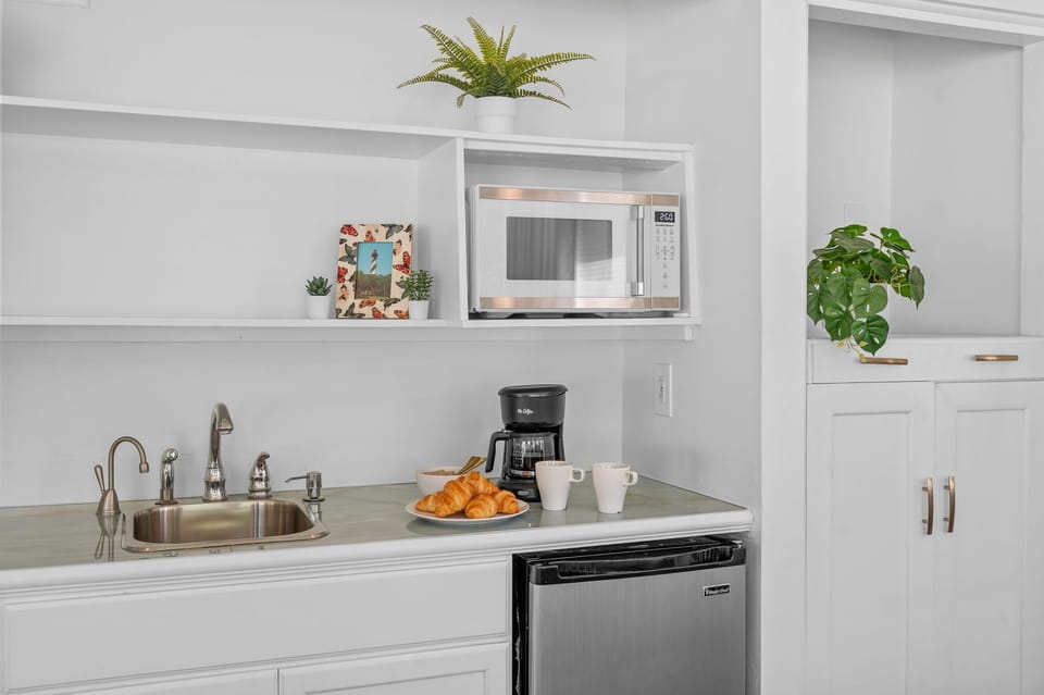 Open and welcoming dining area perfect for shared meals and meaningful conversations. Features a spacious table with comfortable seating, ideal for family dinners, group gatherings, or enjoying takeout after a day of exploring.