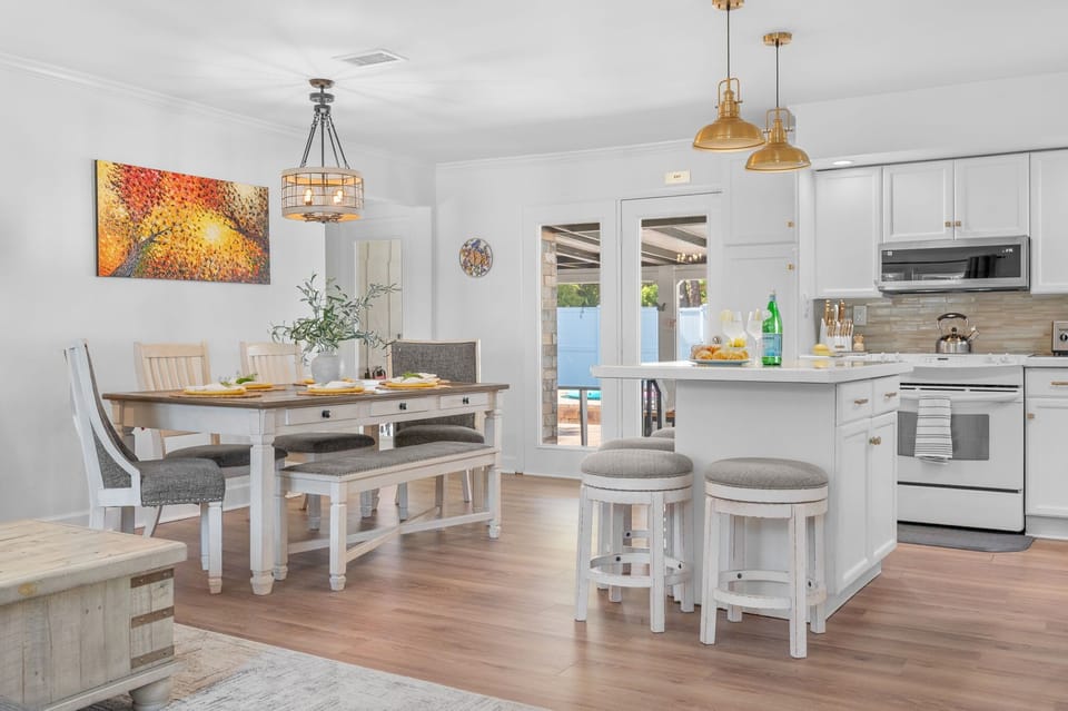 Open and welcoming dining area perfect for shared meals and meaningful conversations. Features a spacious table with comfortable seating, ideal for family dinners, group gatherings, or enjoying takeout after a day of exploring.