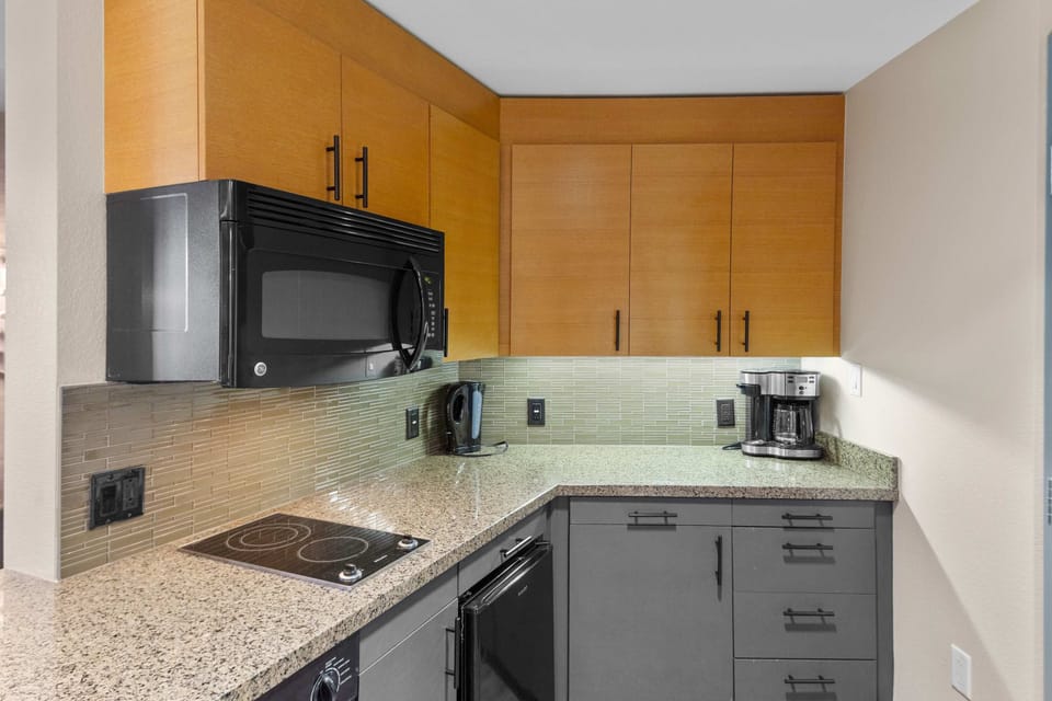 Kitchenette: Stone Counters, 2-Burner Range, Dishwasher, Microwave