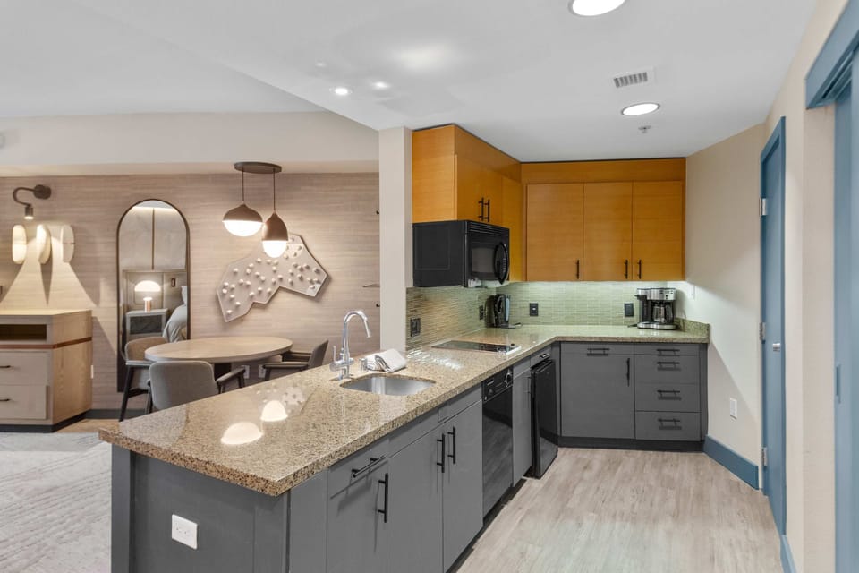 Kitchenette: Stone Counters, 2-Burner Range, Dishwasher, Microwave