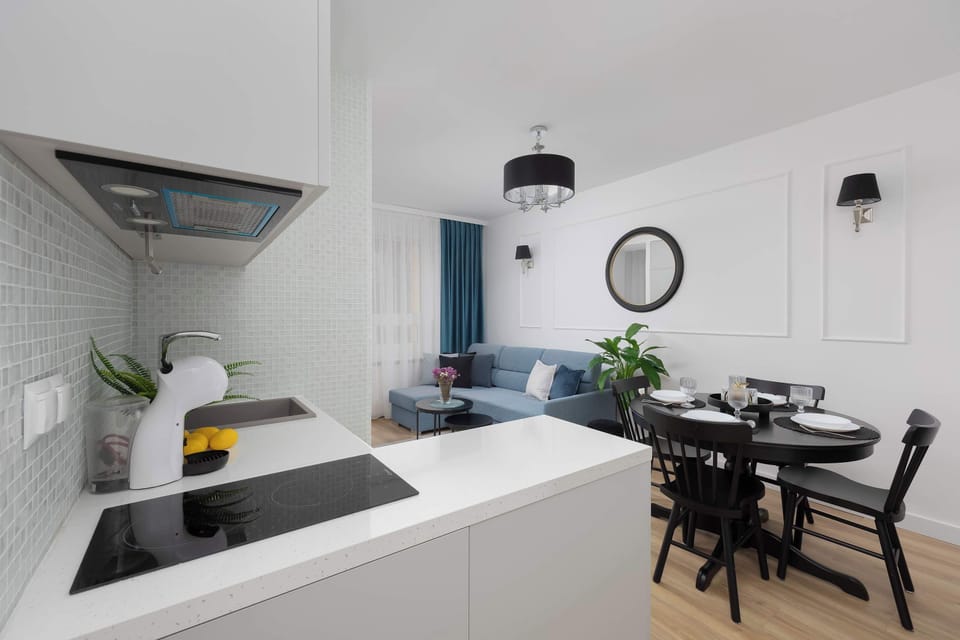 The modern kitchen with a dining area offers comfortable conditions for cooking meals and enjoying time together.