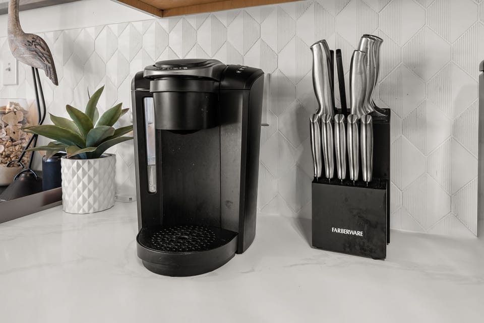 Brew your morning coffee with ease using this sleek single-serve machine, perfectly paired with professional-grade knives for all your culinary adventures.