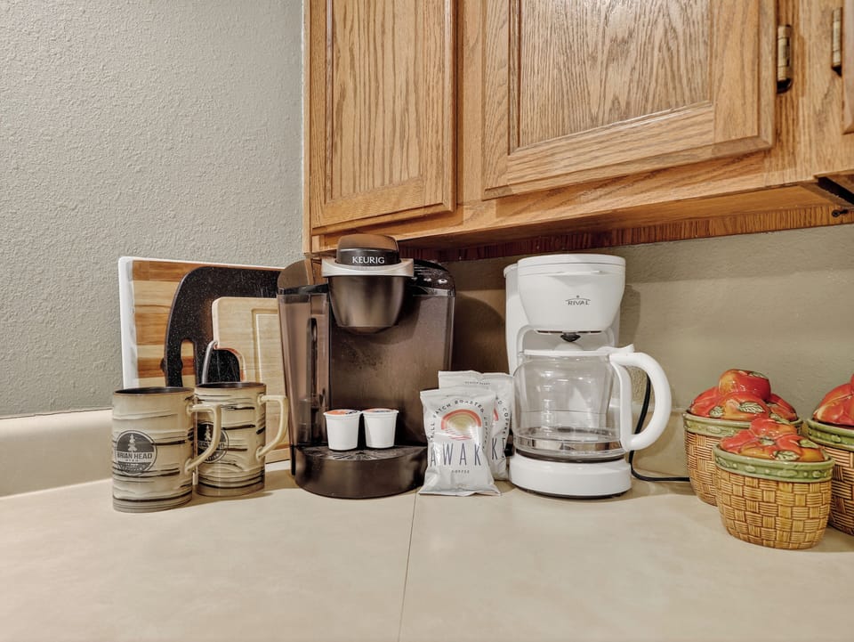 Start your mornings right with your own coffee station featuring both Keurig and drip coffee makers, plus everything you need for that perfect cup in your home away from home.