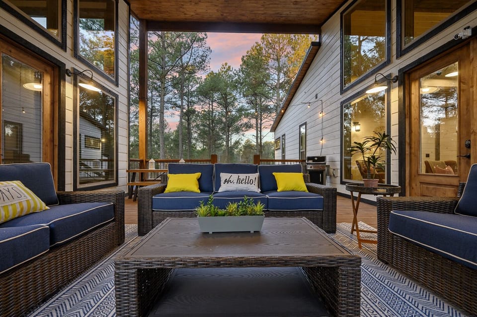 Your new favorite spot! This covered deck is a guest favorite because everyone can connect in one dreamy covered spot! The hot tub sits right here under full cover, so you can soak while the fireplace glows+ the game plays on the outdoor TV. 