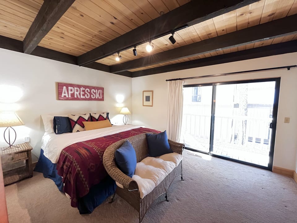 Bedroom 1 is on the first floor, has a king bed, and access to a private balcony