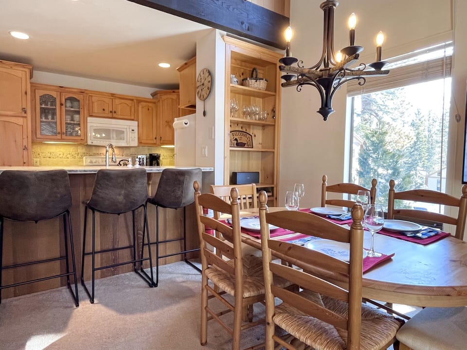 The dining table seats 6 comfortably and the counter seats 5 comfortably.