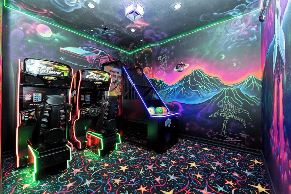 🕹️ The Arcade: Play All Day
Right next door is your private arcade, with commercial-grade arcade machines — set to free, unlimited play. Race each other, and shoot baskets and compete to your heart’s content. No tokens. No timers. 