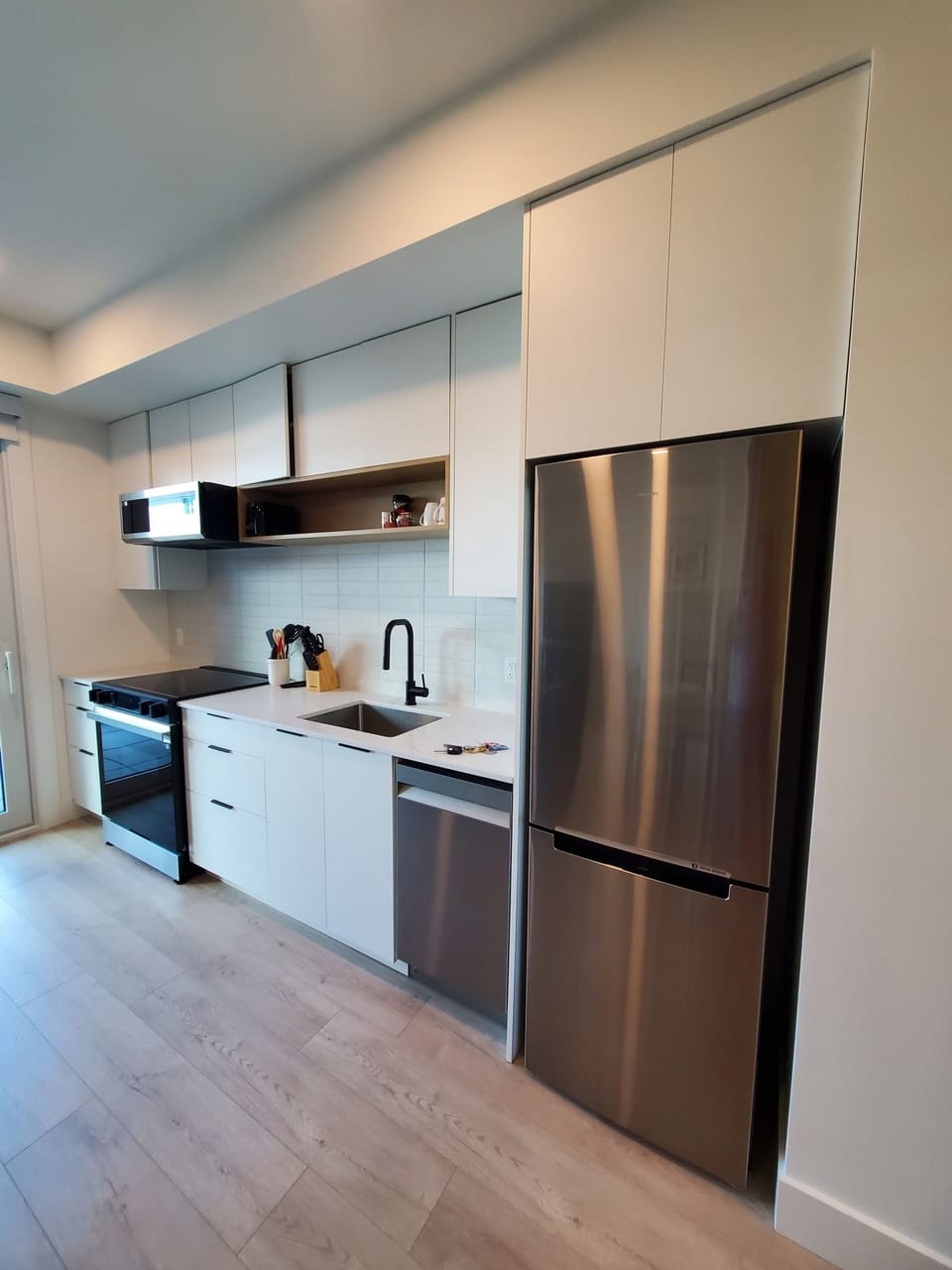Fridge, freezer, dishwasher, stove and oven.  Quality kitchenware and dishware.
