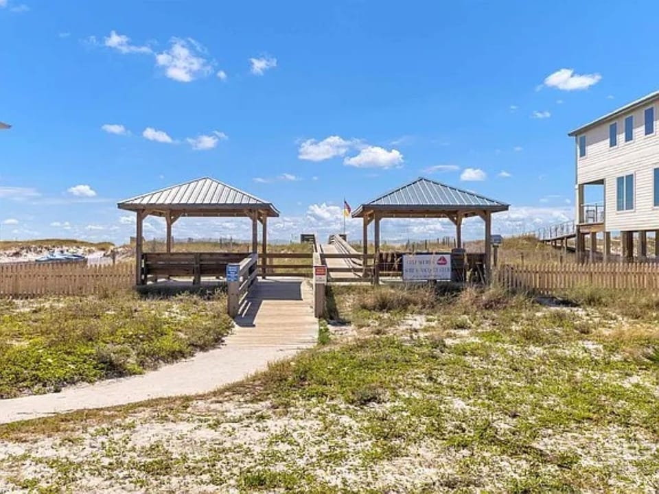 Private beach entrance steps away.