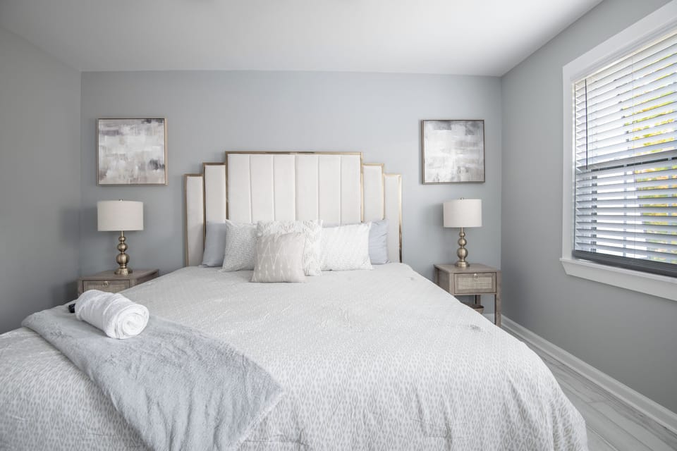 Sink into comfort in this bright and stylish bedroom—your peaceful retreat awaits.
