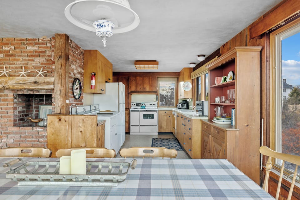 Dining table looking into kitchen.