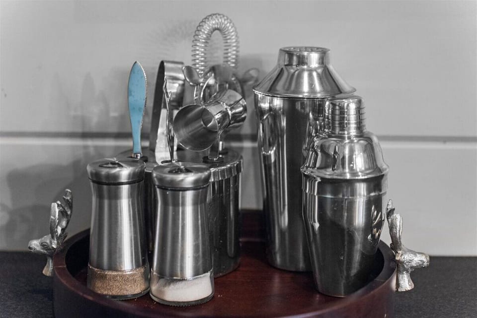 Stainless steel bar tools arranged neatly for mixing cocktails and preparing drinks with ease