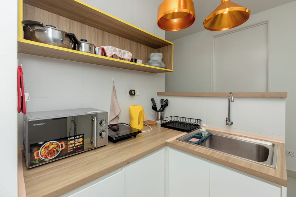 Fridge, electric kettle, cookware/dishes/utensils