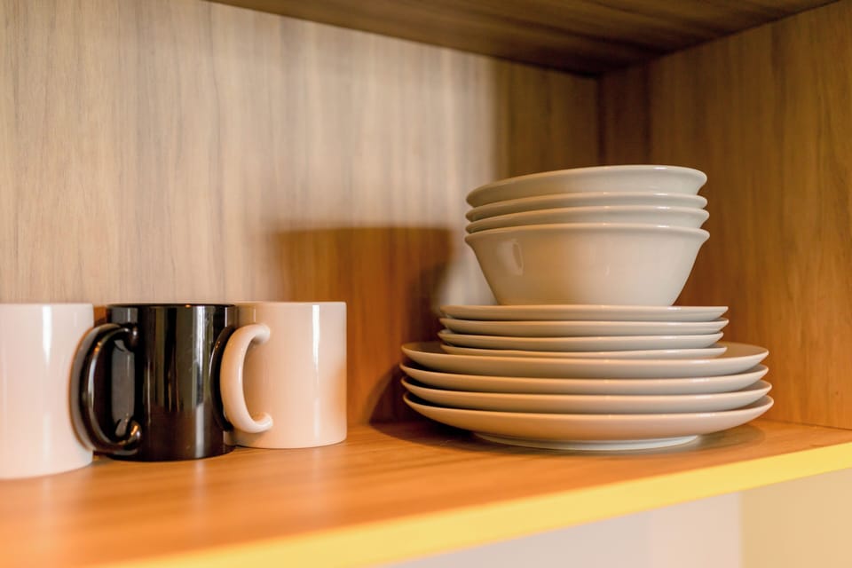 Fridge, electric kettle, cookware/dishes/utensils
