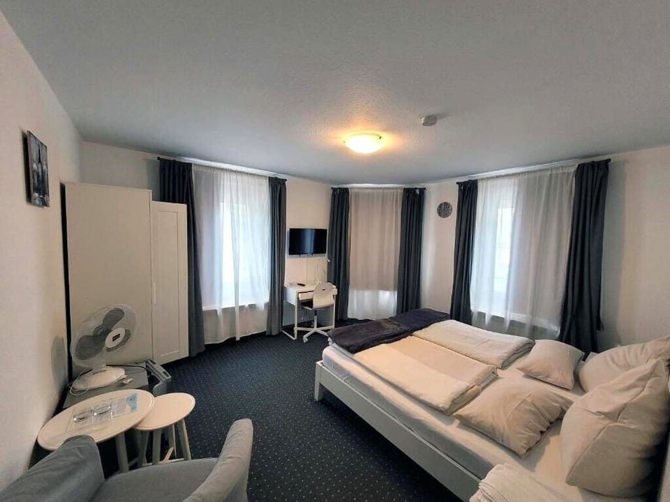 Double Room, City View | Hypo-allergenic bedding available, laptop workspace, blackout drapes