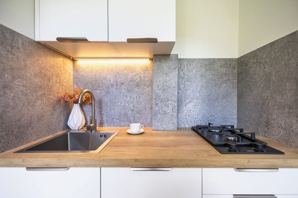 Apartment, City View | Private kitchen | Espresso maker, electric kettle, dining tables