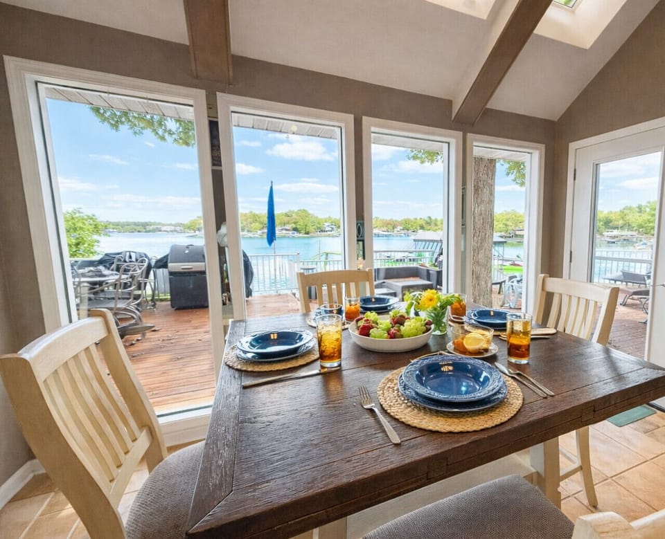 Dining space with lake views and patio access.
