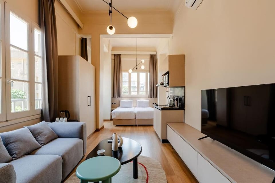 Deluxe Apartment, 1 Bedroom | Living area | 45-inch Smart TV with digital channels, streaming services