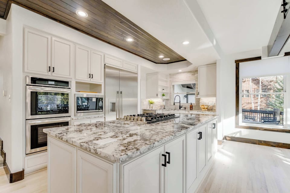 The primary kitchen with double oven, gas range, microwave and coffee bar.  Plus plenty of small appliances for those family meals!