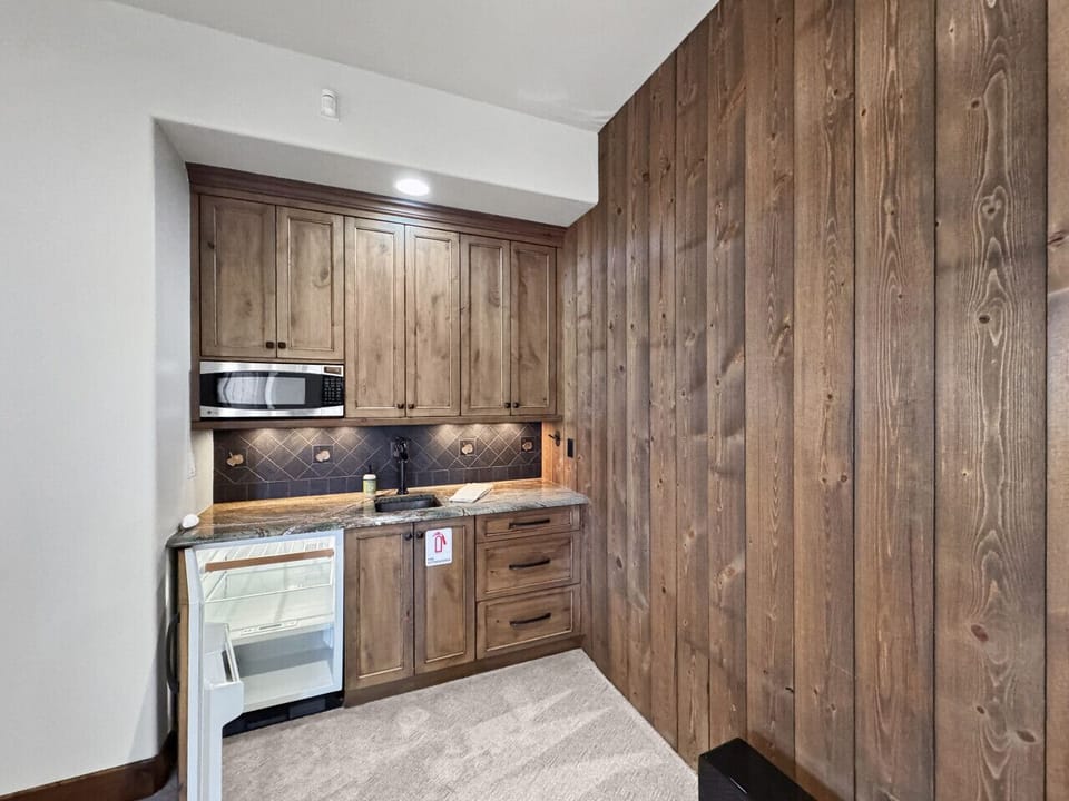 Bar area with mini fridge means drinks stay cold and nobody`s running upstairs mid-hot tub. Stock it once, enjoy all week. Little conveniences like this make vacation actually feel like vacation.