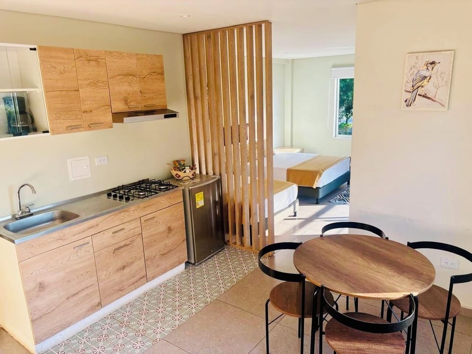 Family Studio Suite, Balcony, City View | Iron/ironing board, WiFi (free), bed sheets