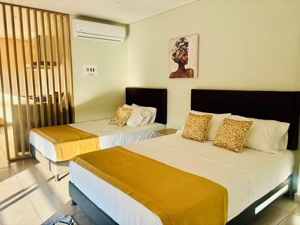 Family Studio Suite, Balcony, City View | Iron/ironing board, WiFi (free), bed sheets