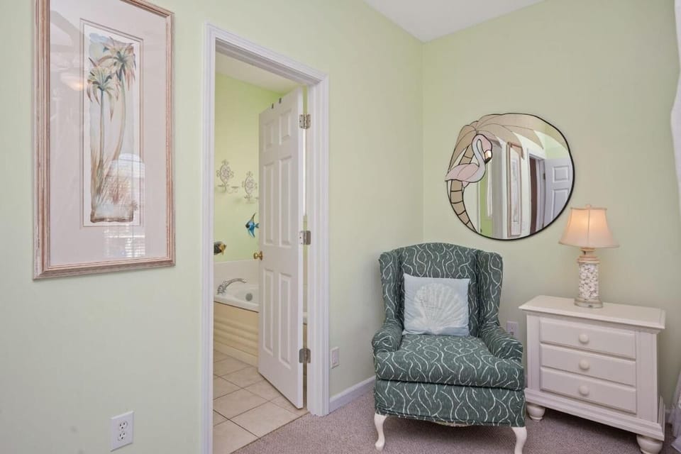 master bedroom chair near bathroom