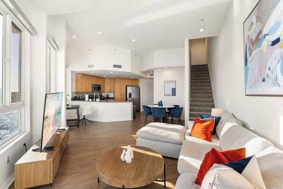 Loft-style open space flows from the chef's kitchen to cozy seating areas.