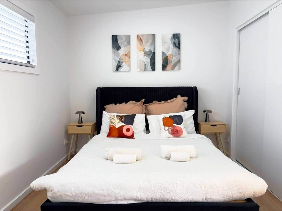 Peaceful bedroom with a comfortable bed, designed for a restful night’s sleep.