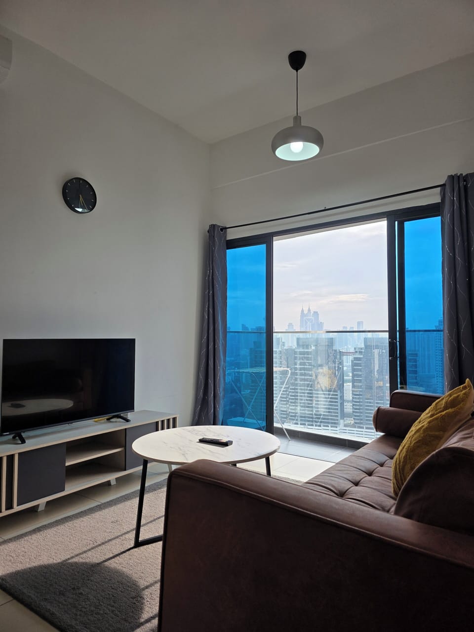 Standard Apartment, Balcony, City View | Living area | 50-inch LED TV with digital channels