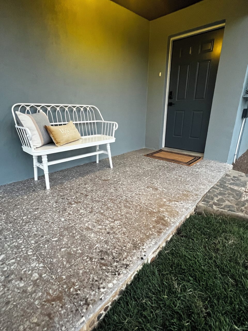 A seating area in the front yard provides a perfect spot to relax and unwind.