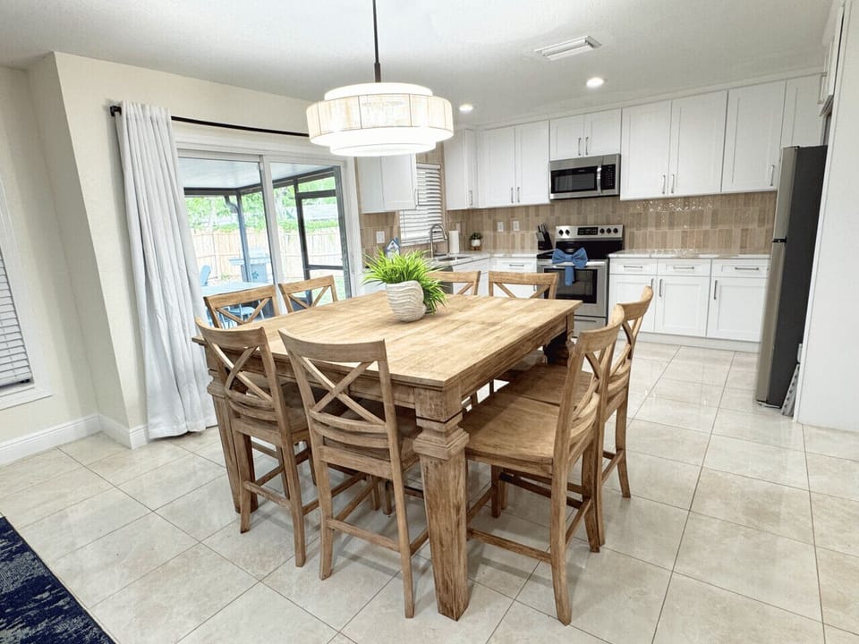 Gather around the dining table with seating for 8 and enjoy meals together, with a Smart TV nearby for added entertainment
