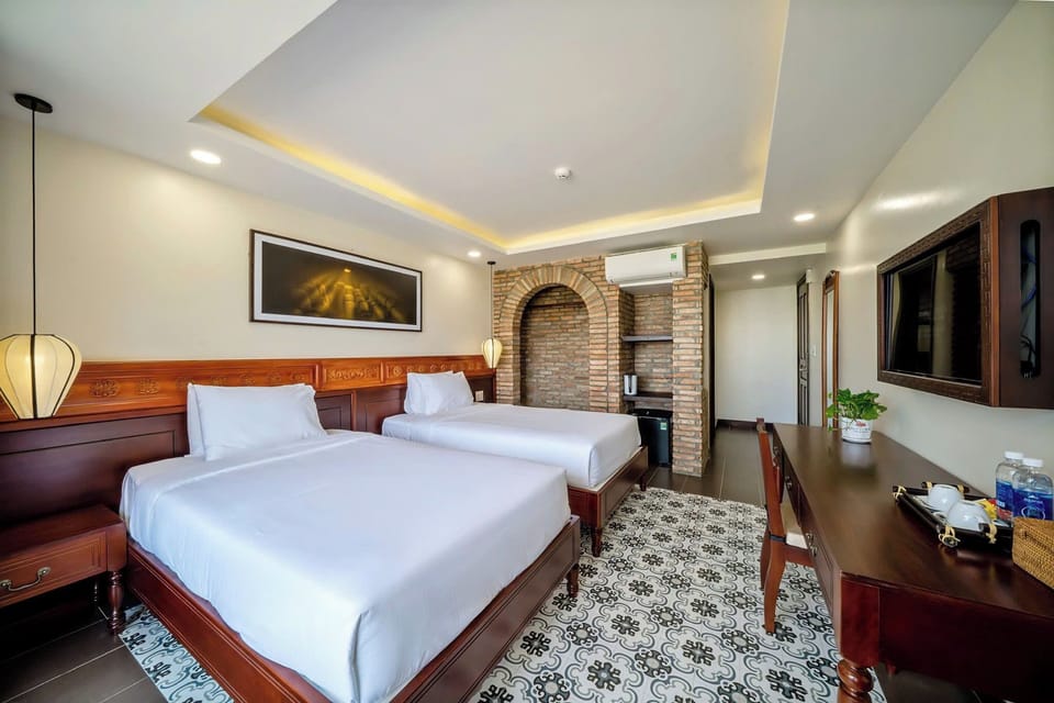 Twin Room | Minibar, desk, laptop workspace, blackout drapes