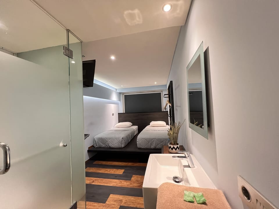 Basic Twin Room | Laptop workspace, free WiFi, bed sheets