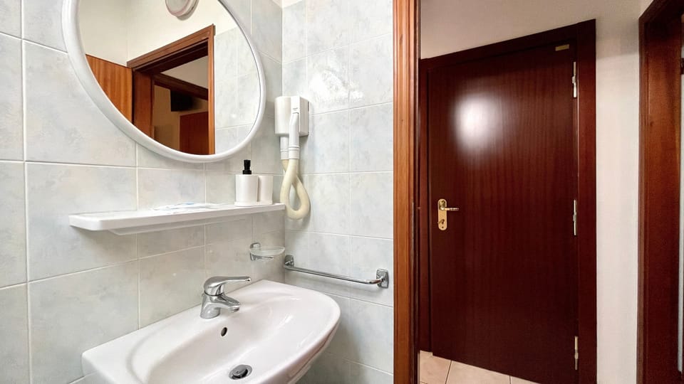 Family Room, Balcony | Bathroom | Shower, hair dryer, towels, soap