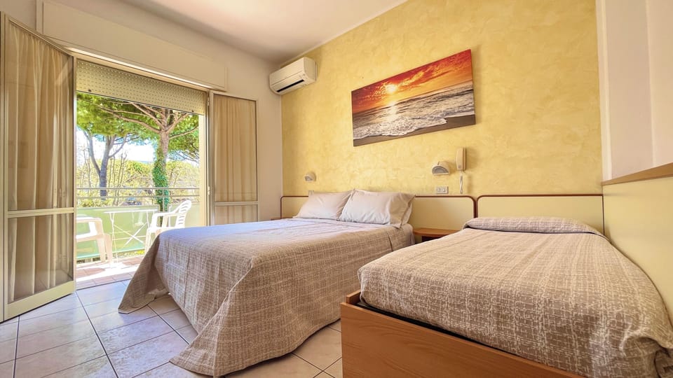 Triple Room, Balcony | In-room safe, desk, free WiFi, bed sheets