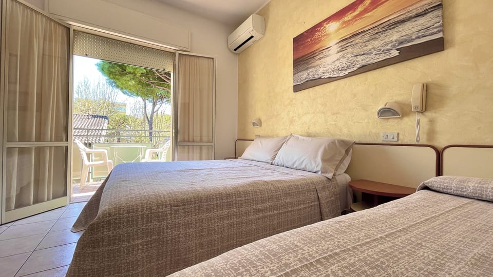 Triple Room, Balcony | In-room safe, desk, free WiFi, bed sheets