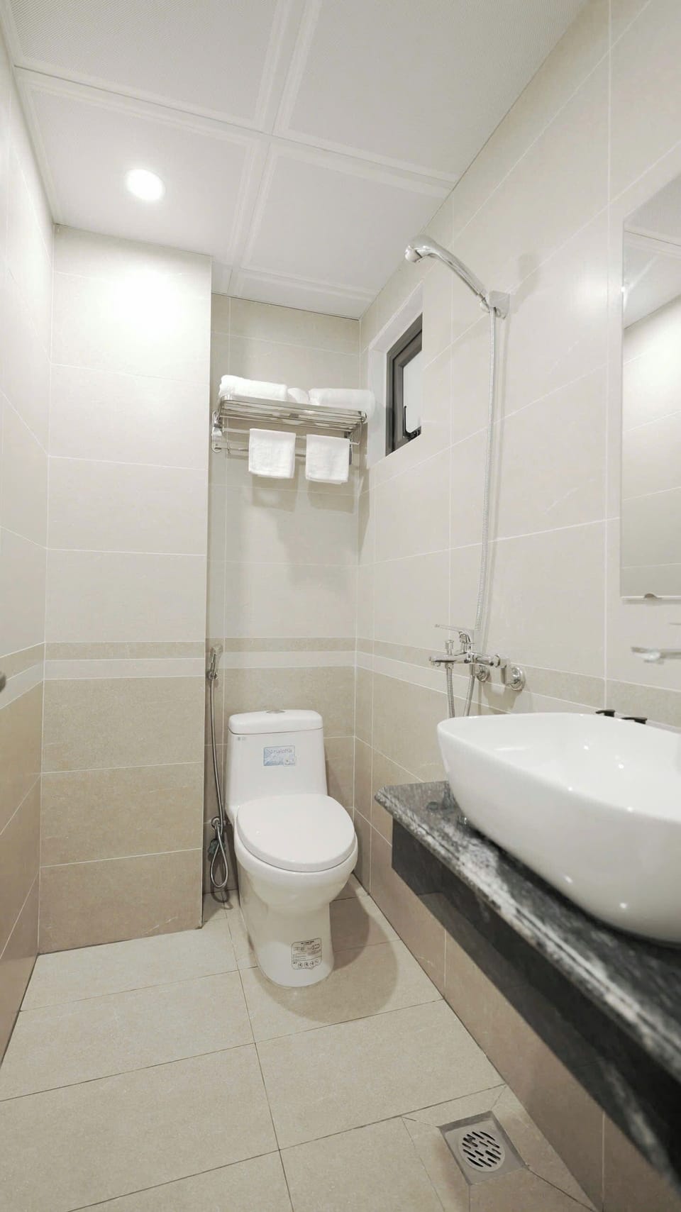 Separate tub and shower, rainfall showerhead, hair dryer, slippers