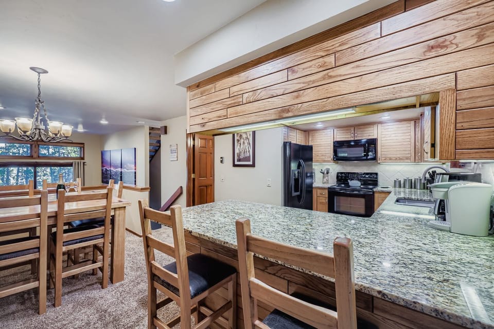 Open kitchen and dining area with seating for 8.