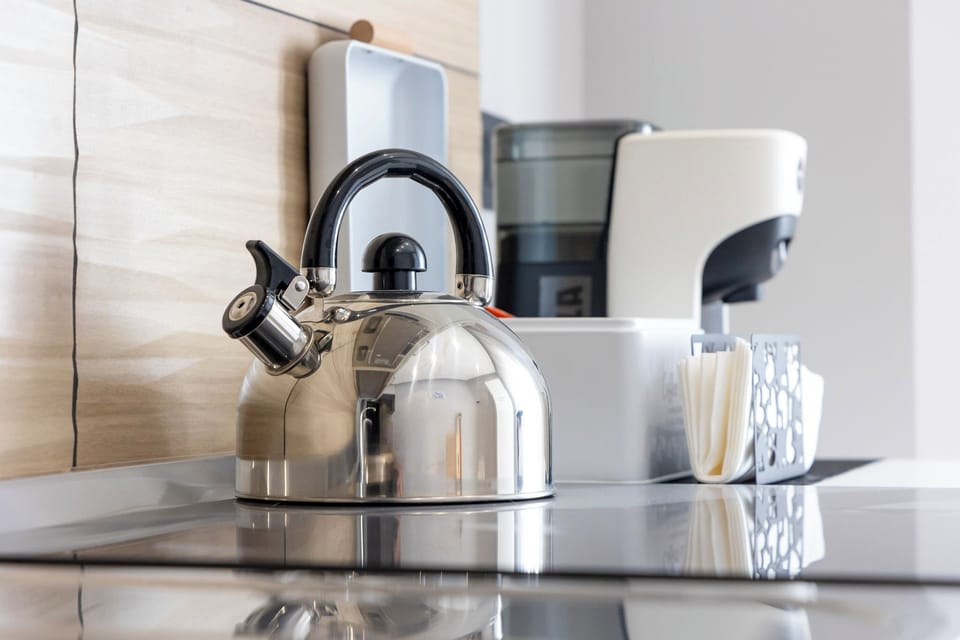 Condo, Balcony, City View | Private kitchen | Electric kettle
