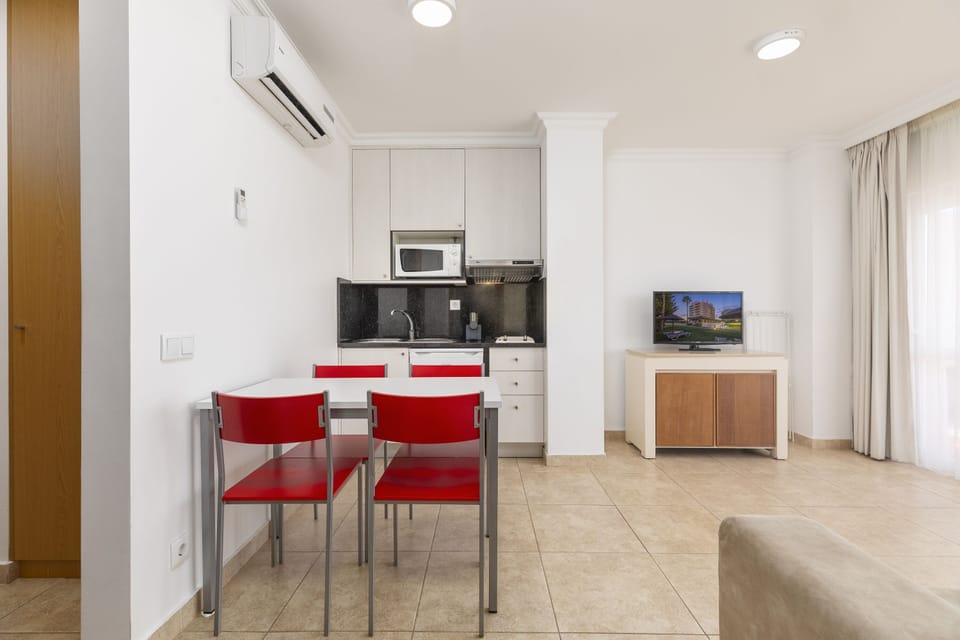 Apartment, 1 Bedroom | Living room | 37-inch flat-screen TV with cable channels, TV
