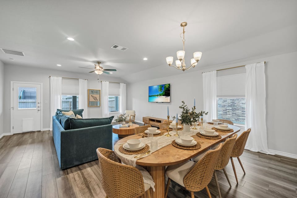 Spacious dining area with seating for six, perfect for shared meals and relaxing evenings during your stay.