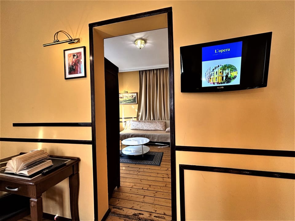 Deluxe Double Room, Balcony, City View | In-room safe, desk, soundproofing, iron/ironing board