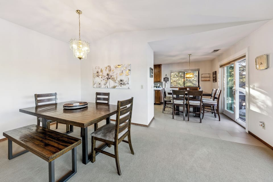 Gather around your spacious dining area featuring elegant wood tables and stylish lighting, perfect for memorable meals with loved ones.