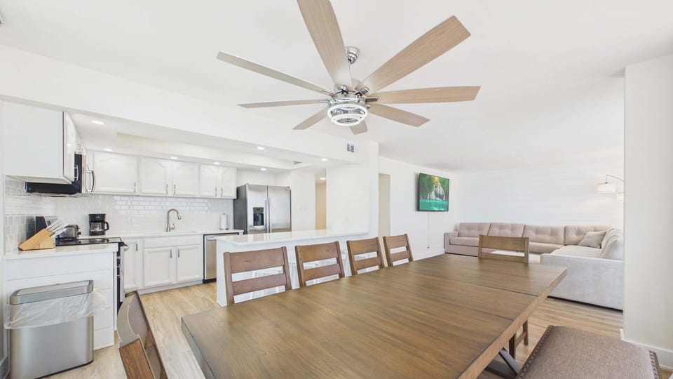 Dining area table with chair and bench seating + breakfast bar attached to kitchen counter
