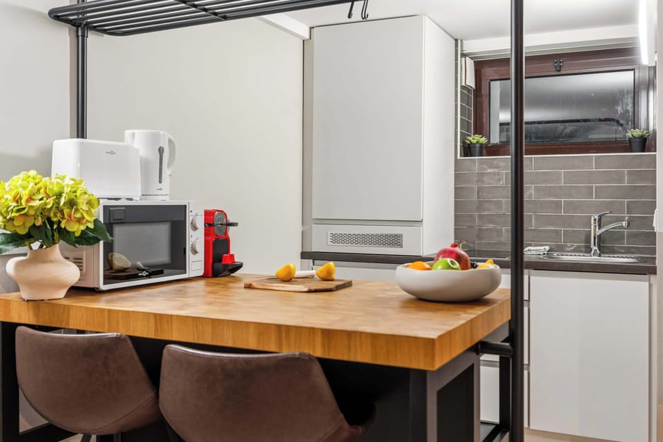 A warm, inviting dining space where you can enjoy morning coffee or a home-cooked meal—complete with everything you need for a comfortable stay.