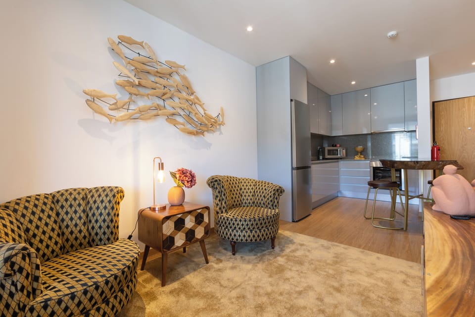Apartment, River View | Living area | Smart TV