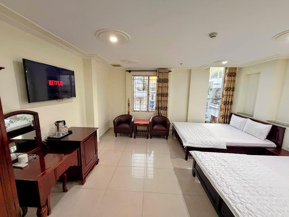 Family Room, City View | Desk, laptop workspace, blackout drapes, soundproofing