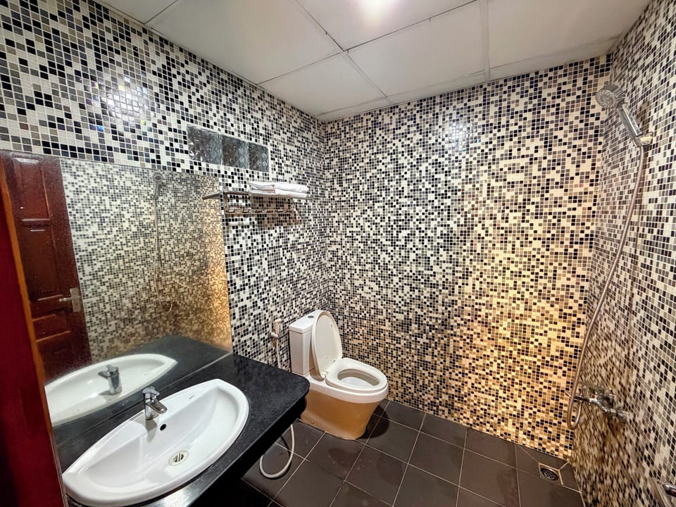 Family Triple Room | Bathroom | Shower, free toiletries, hair dryer, slippers